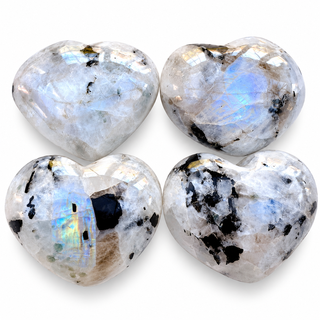 Group of polished Rainbow Moonstone heart-shaped palm stones showing natural variations