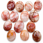 Group of polished Fire Quartz palm stones showing natural variations