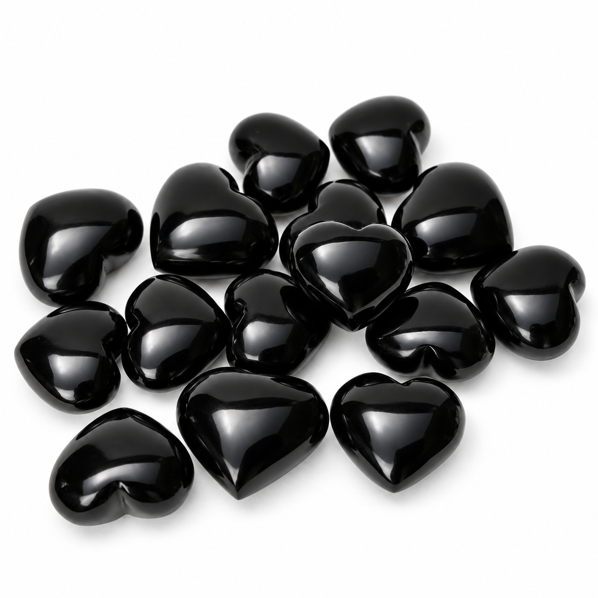 Group of polished Black Obsidian heart-shaped palm stones showing natural variations
