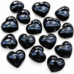 Collection of polished Black Obsidian heart palm stones showing natural variations