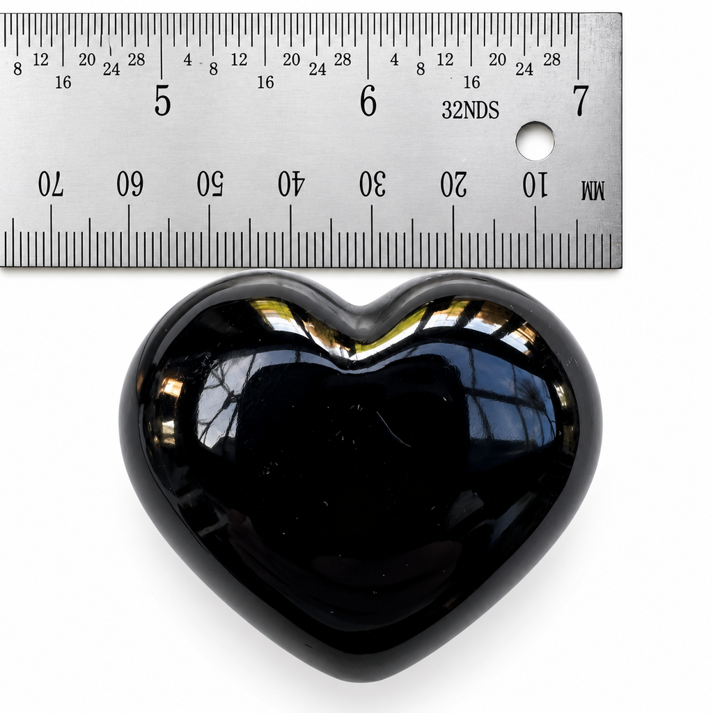 45mm Black Obsidian heart palm stone shown beside ruler for size reference