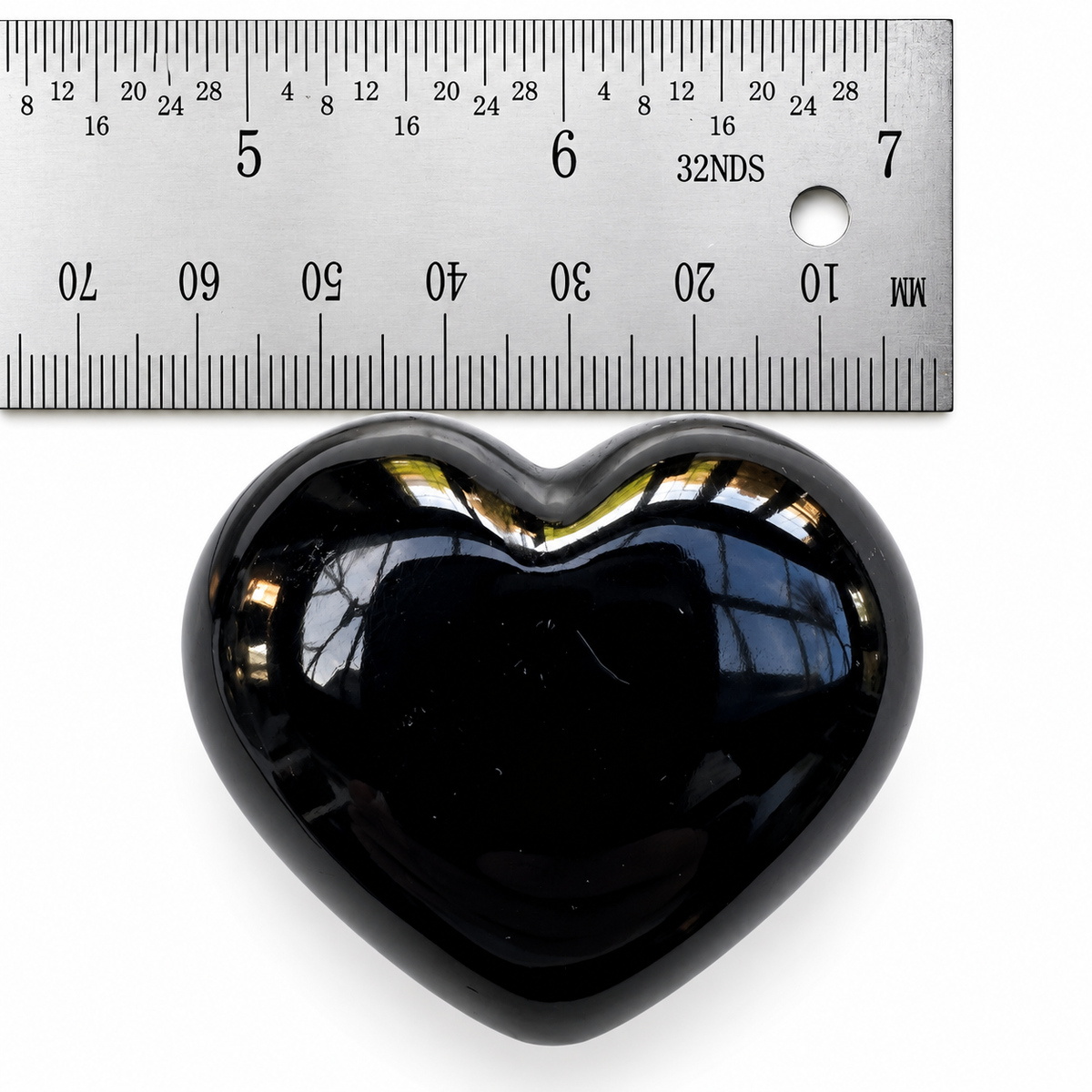 45mm Black Obsidian heart palm stone shown beside ruler for size reference
