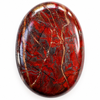 Close-up of a polished red and grey Jasper palm stone with brecciated pattern