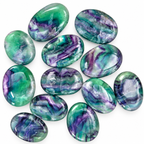 Group of polished Rainbow Fluorite palm stones with green and purple patterns