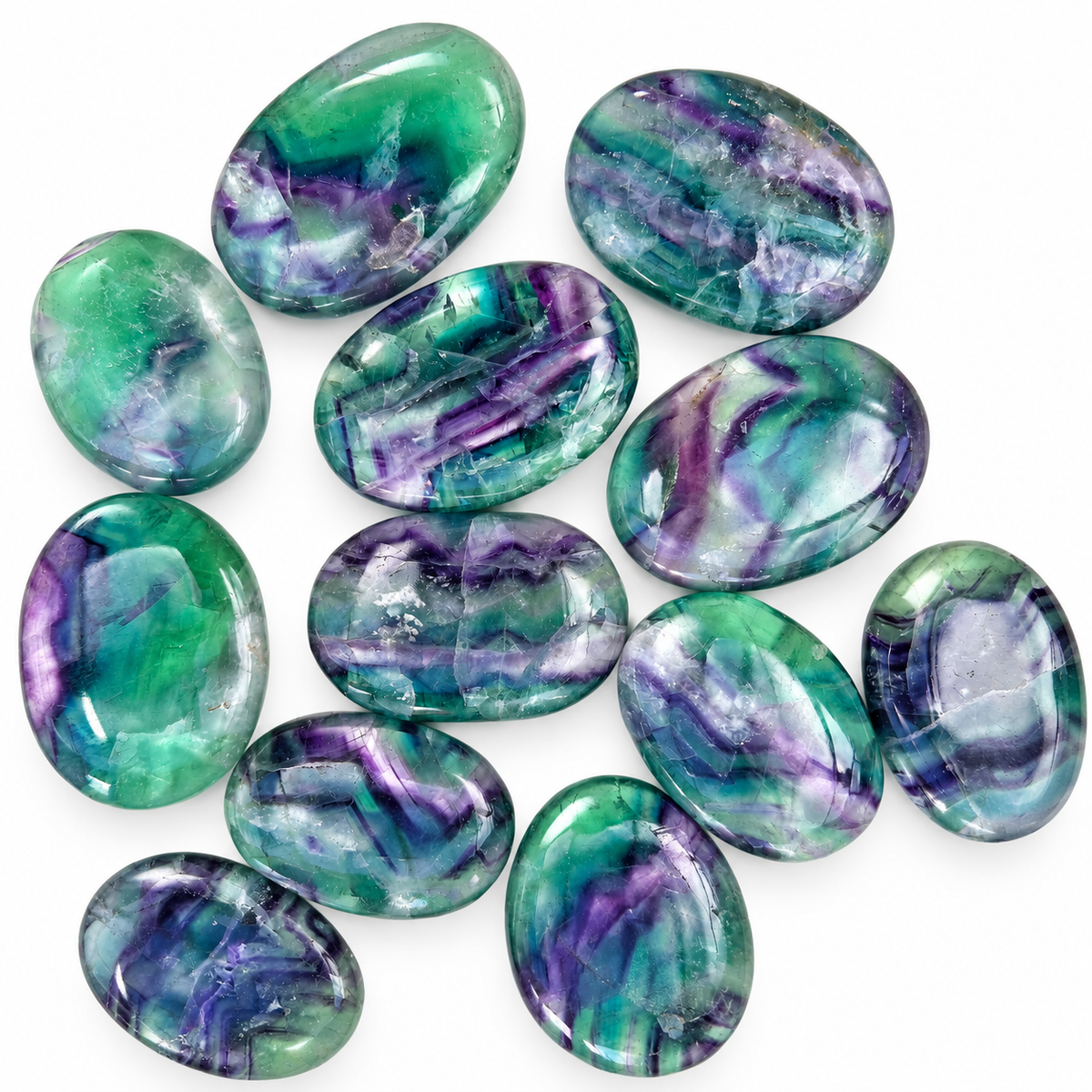 Group of polished Rainbow Fluorite palm stones with green and purple patterns