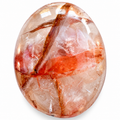 Polished Fire Quartz palm stone showing natural colour and markings