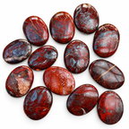 Several polished Red Jasper Hematite palm stones showing different patterns