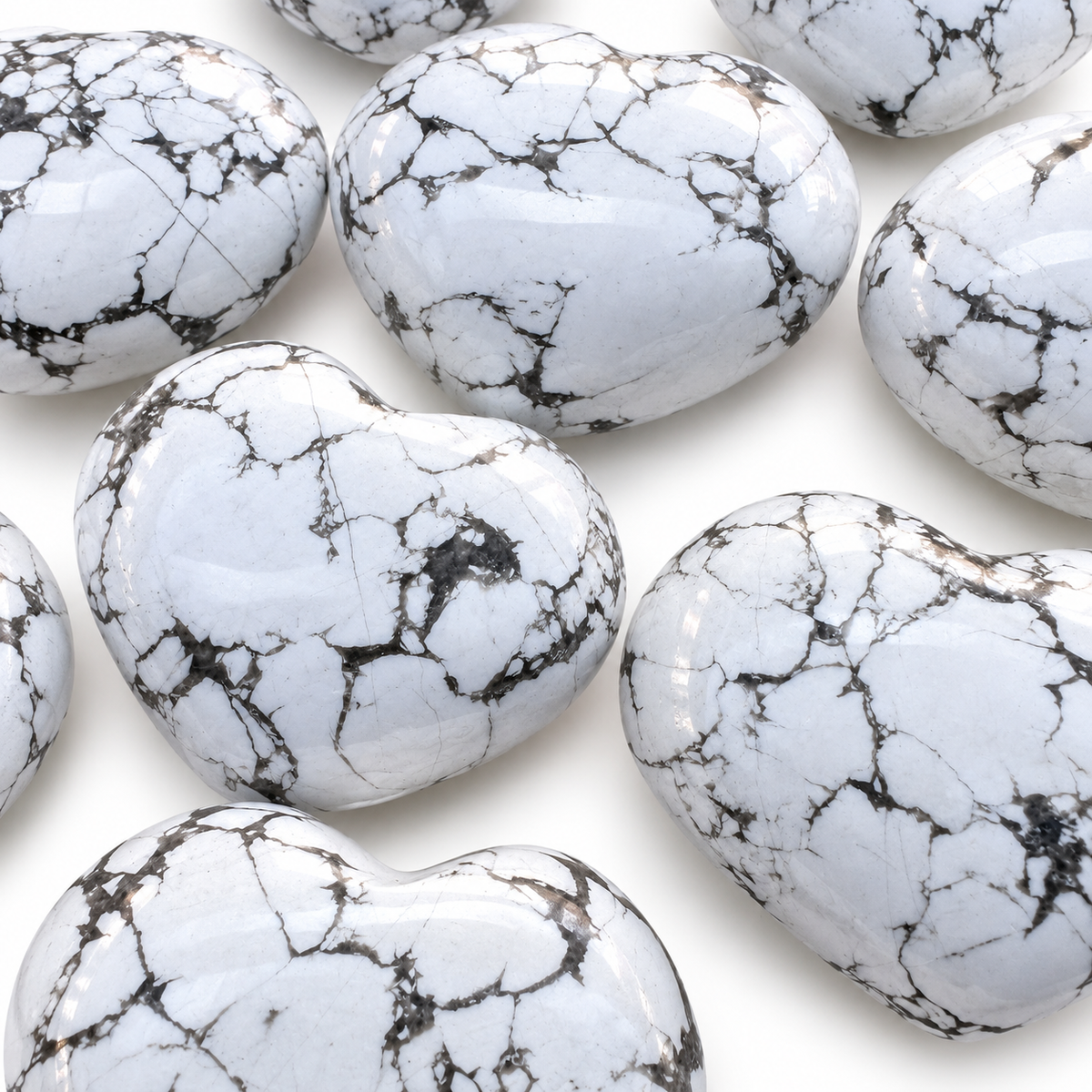 Polished Howlite heart-shaped palm stone showing natural colour and markings