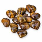Group of polished Tiger Eye heart-shaped palm stones showing natural variations