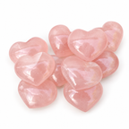 Group of polished Rose Quartz heart-shaped palm stones showing natural variations