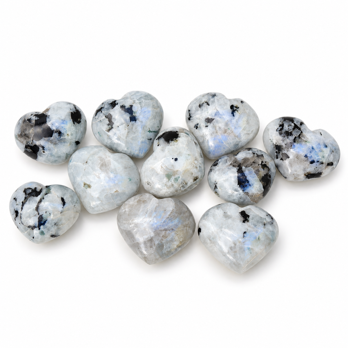 Group of polished Rainbow Moonstone heart-shaped palm stones showing natural variations