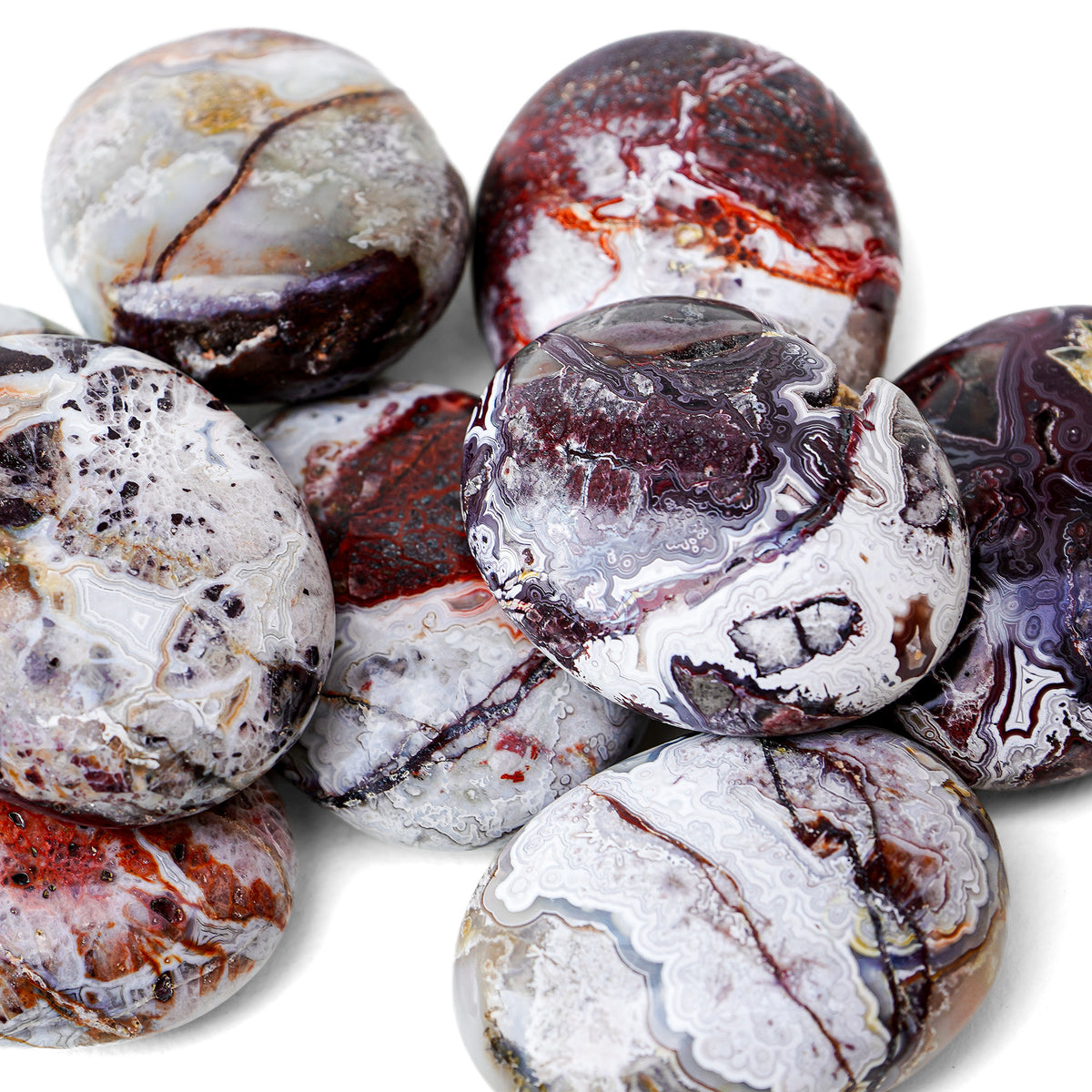 Polished Crazy Lace Agate palm stone showing natural colour and markings