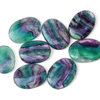 Polished Rainbow Fluorite palm stone showing natural colour and markings