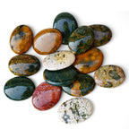 Polished Ocean Jasper palm stone showing natural colour and markings